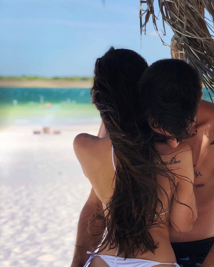 A guy with a girl at sea