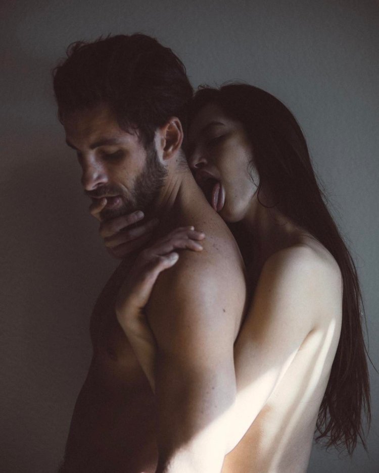 Hugs the girl from behind