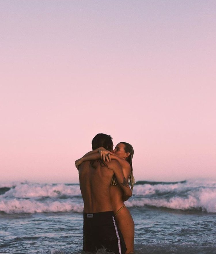 A guy with a girl at sea