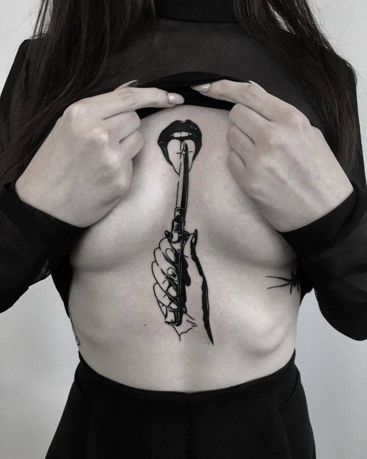 Tattoo girl with a knife