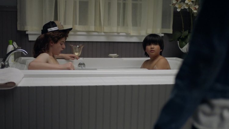 Woman with a boy in the bathroom