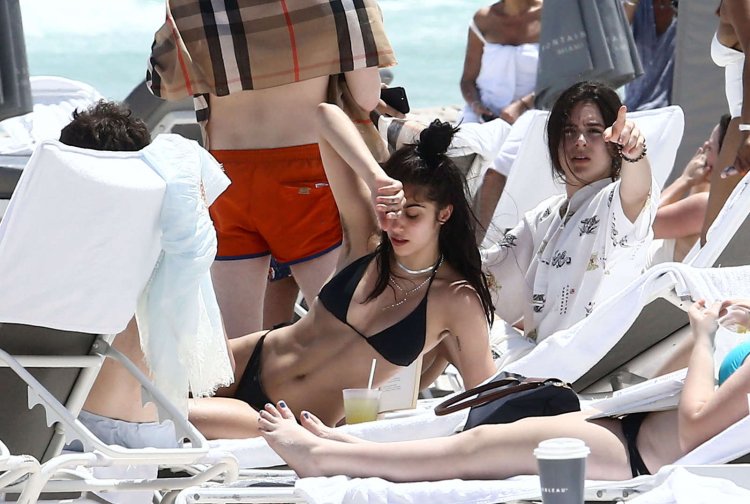 Unshaven armpits on the beach