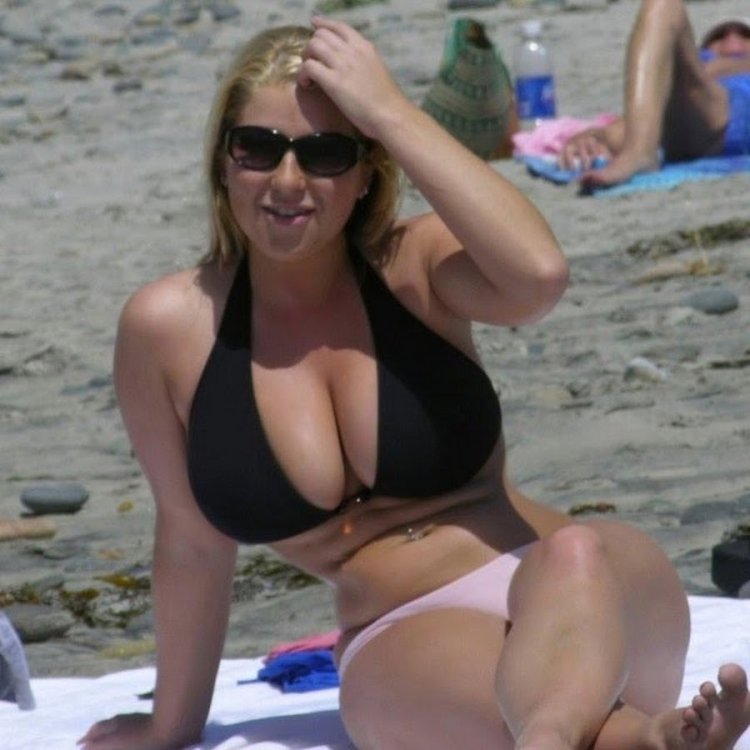 Women with large breasts on the beach