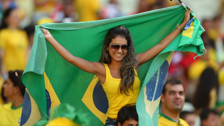 People with the flag of Brazil