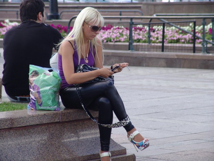 Woman in leggings smokes