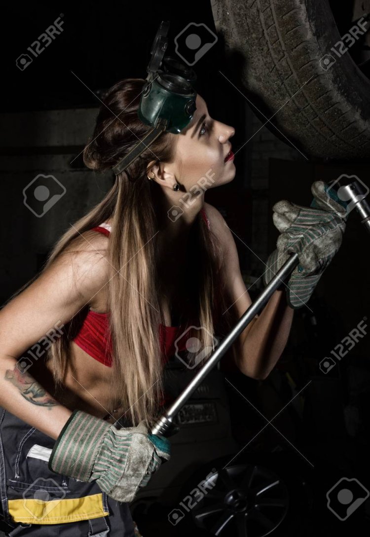 Girl Mechanic in overalls