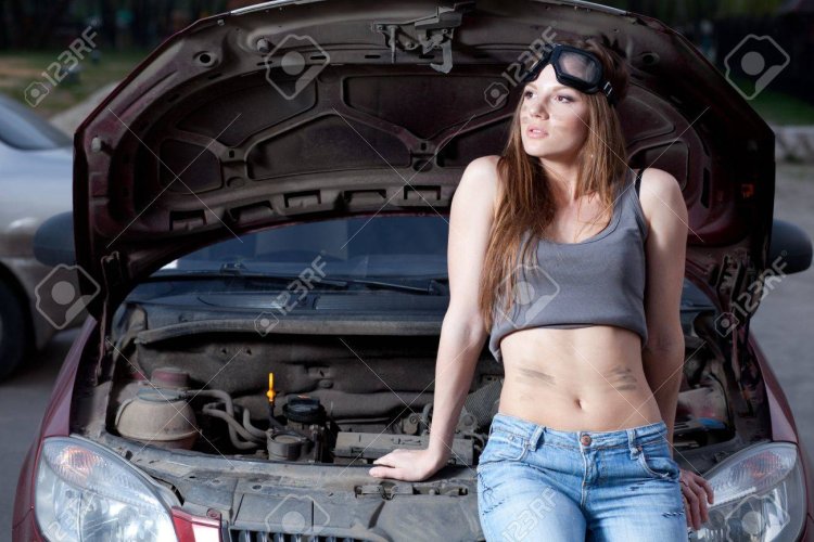 Girl Auto mechanic in a skirt
