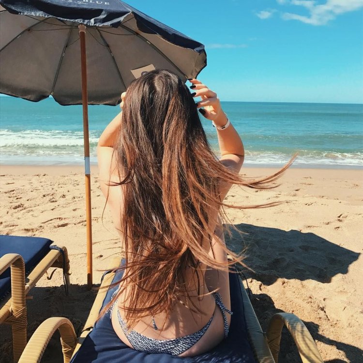 Girl with a haircut on the beach