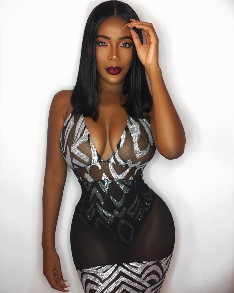 Black girl with a figure of sand clock