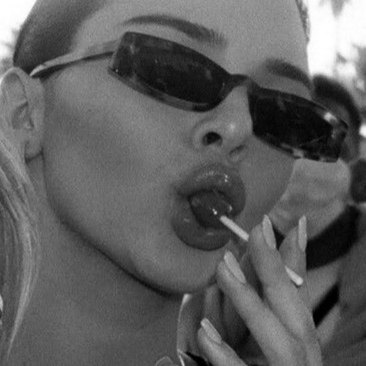 Kendall Jenner with Chupa Chups in his mouth