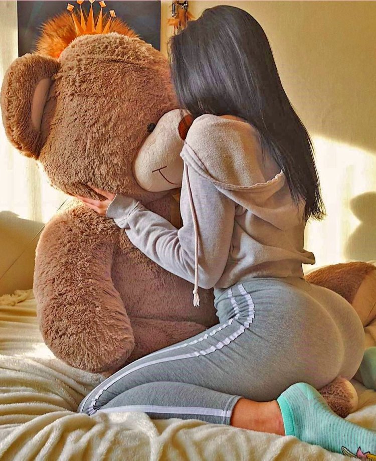 Brunette with a plush bear
