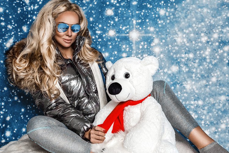 Blonde in a white down jacket