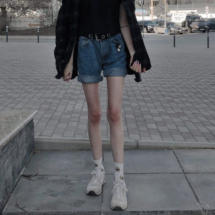 The thin legs of the teenager