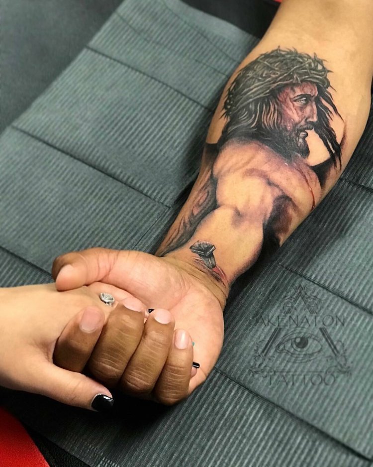 Jesus tattoo on the forearm