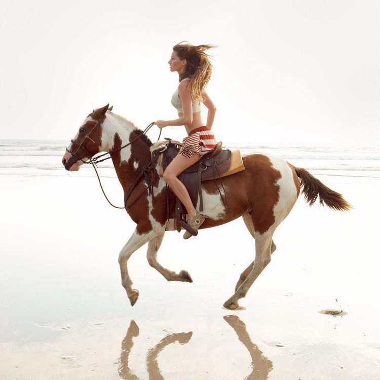 Giselle Bundhen on a black horse