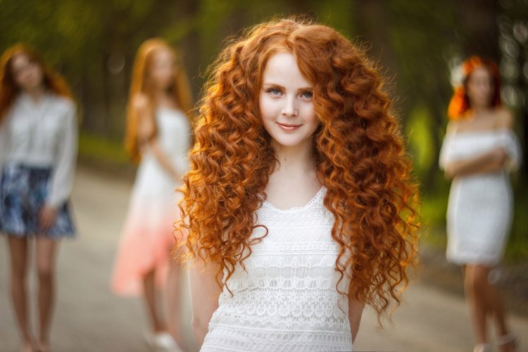 Red curls on blond hair