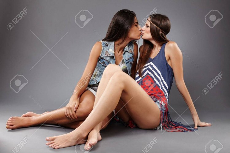 Girl kisses her friend's legs