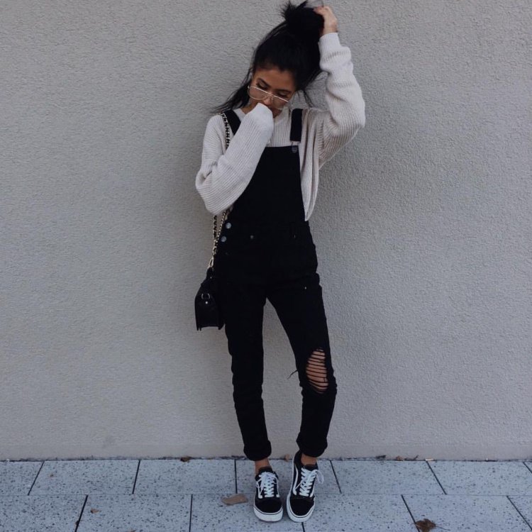 Photos of a girl on ava without a face Dark hair with coffee in torn jeans