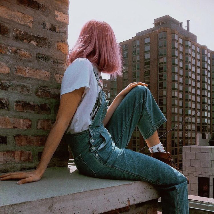 Girl sits on the roof