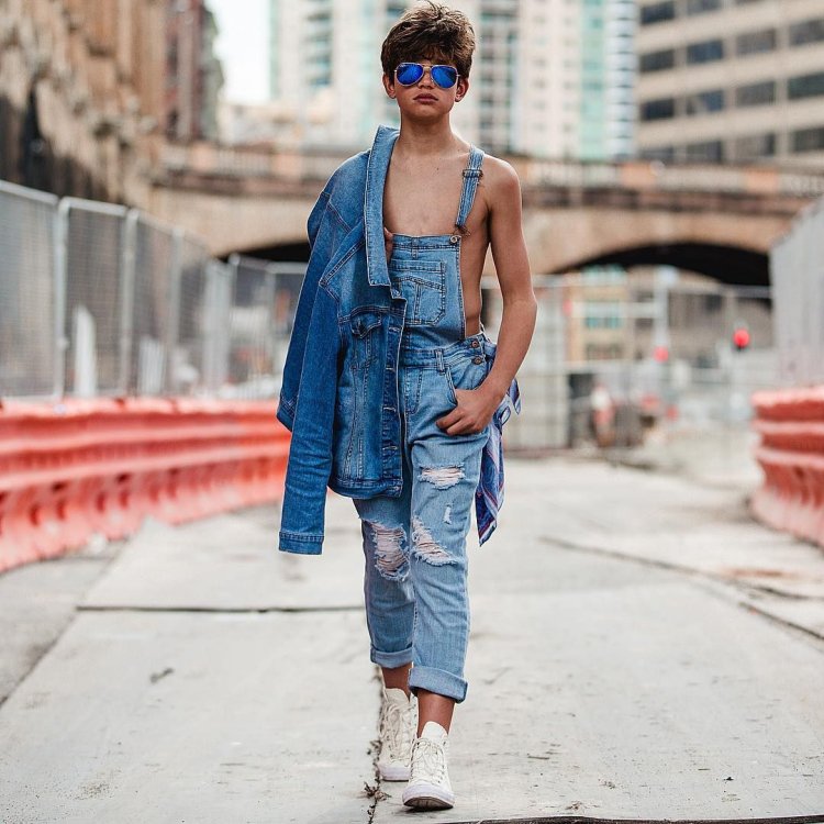 Boy in jeans overalls