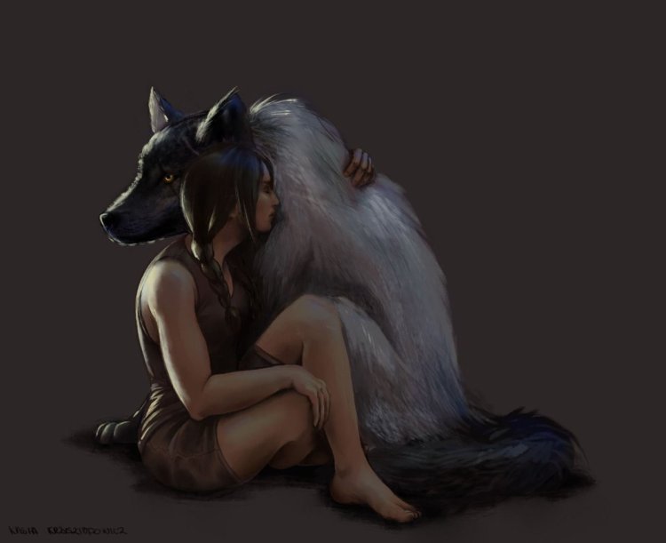 The girl hugs the wolf