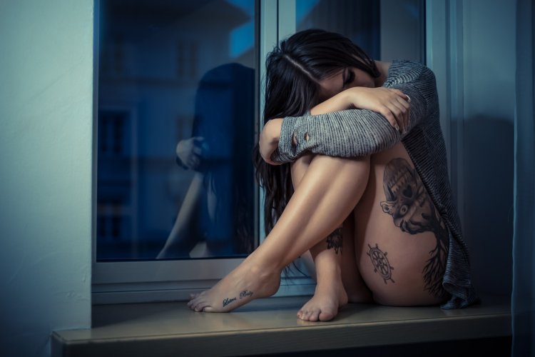 Brunette on the windowsill