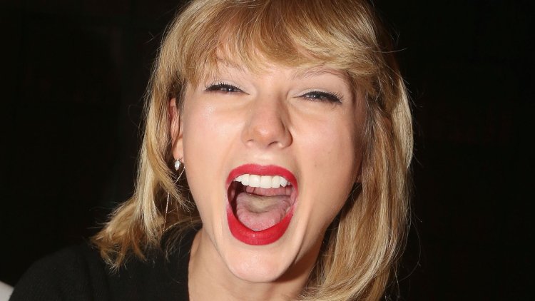 Open mouth of a mature blonde