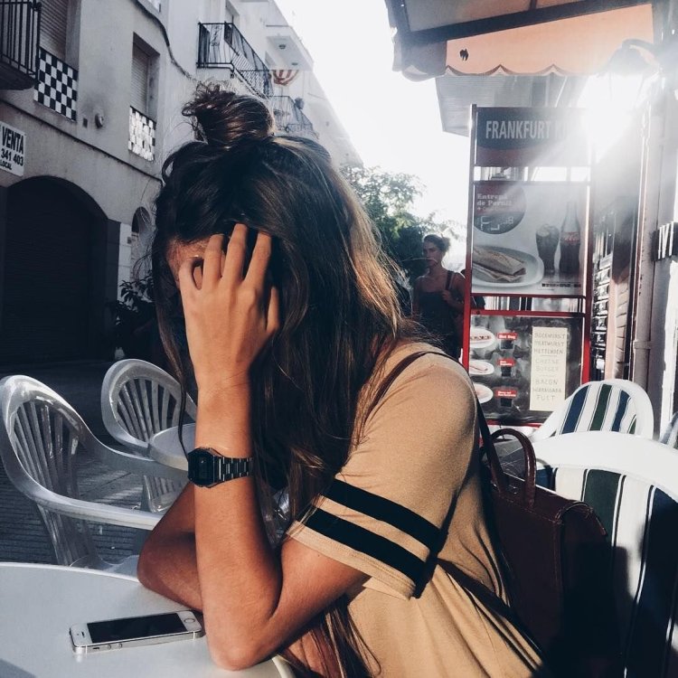 Girl in a cafe with a closed face