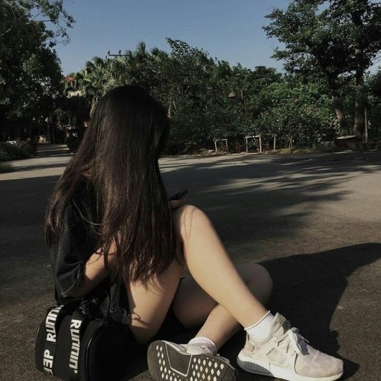 Girl with dark hair on the street