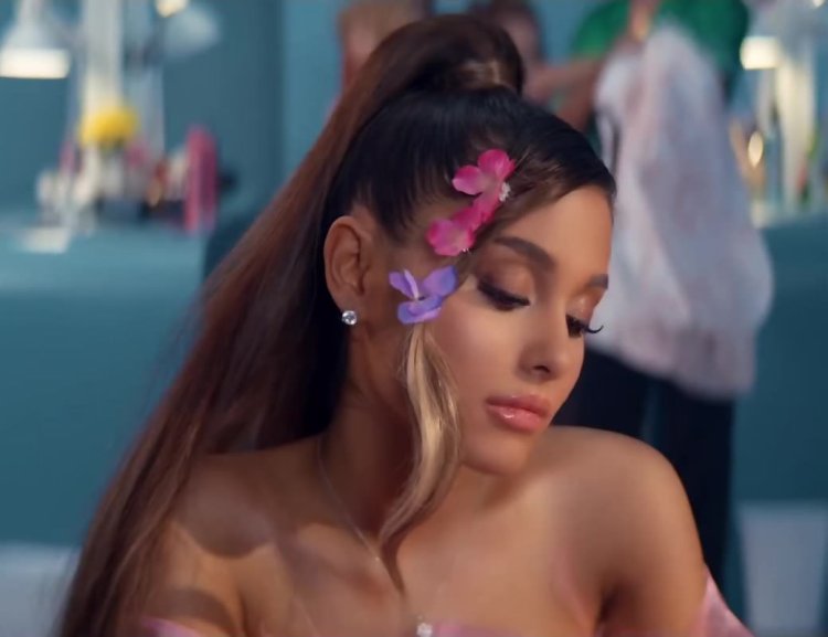 Ariana Grandes winks