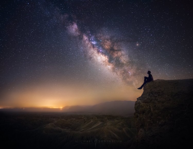 Man against the backdrop of the night sky