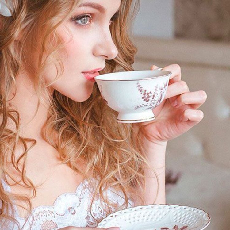 A woman with a cup of tea
