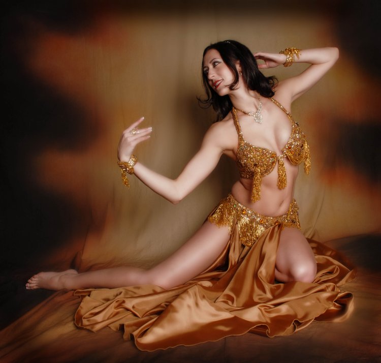The girl performs a belly dance