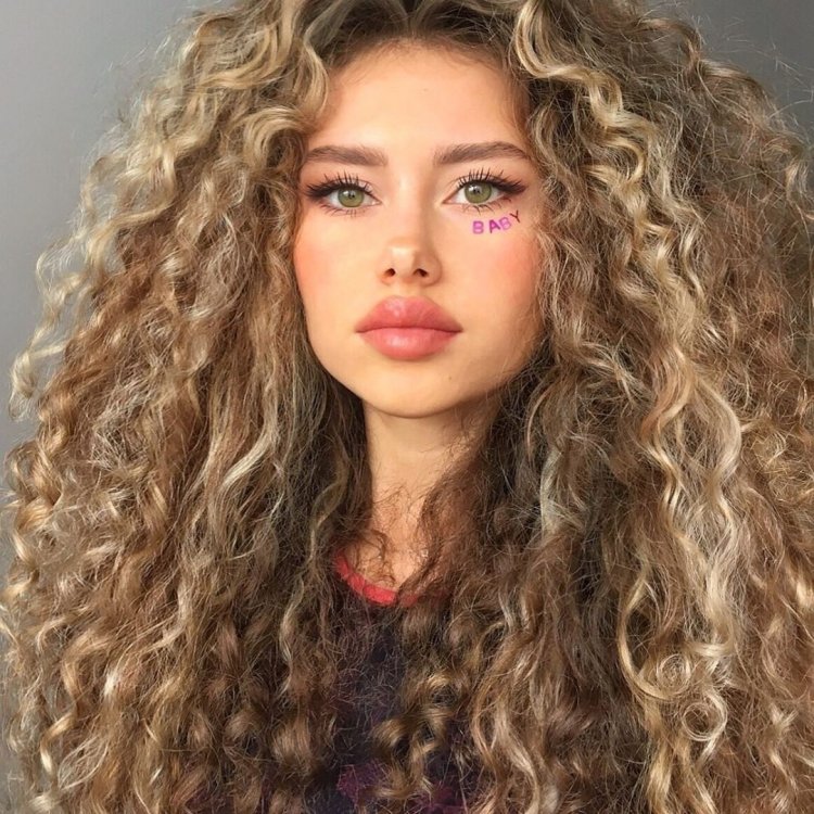 Natalie Litvinova with curls