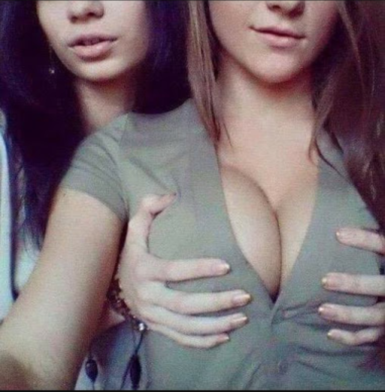 Girl squeezes her chest