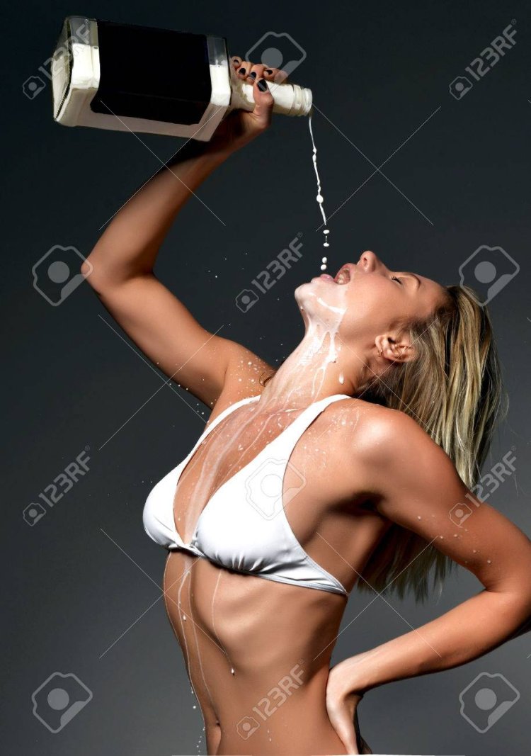 The girl is doused with milk