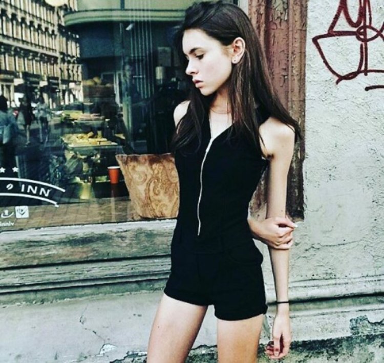 Skinny girl in a sweater