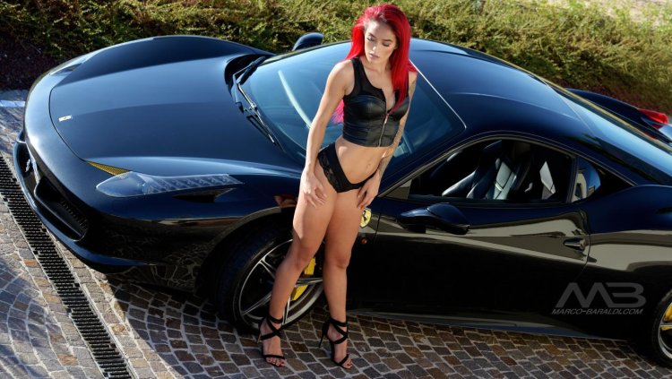 Beautiful girl in black and in the car