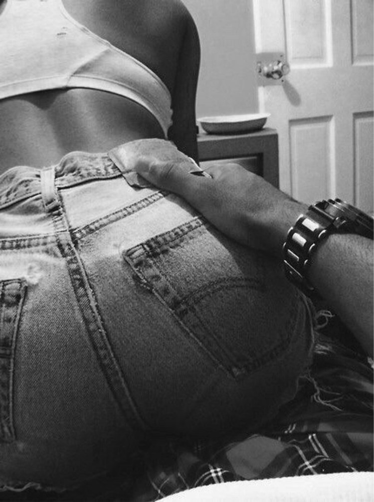 With your hand behind the ass