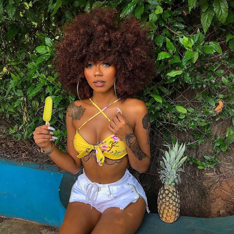 Pineapple girl is a black woman