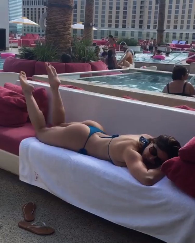 Kendra Last in a swimsuit in the pool