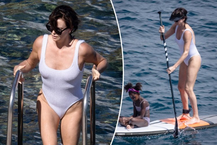 Charlize Theron between the legs