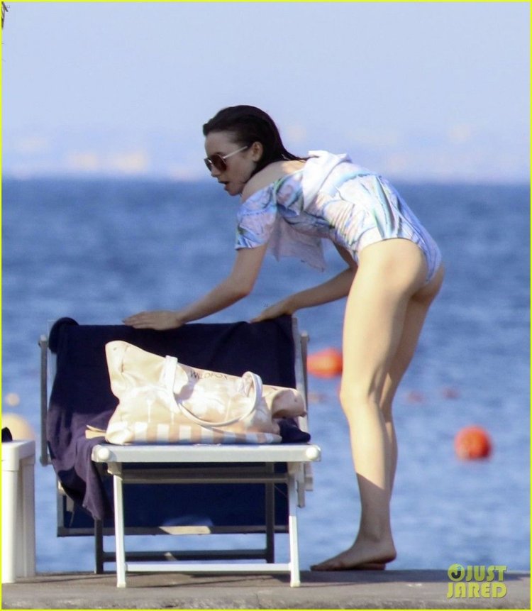 Lily Collins on the beach