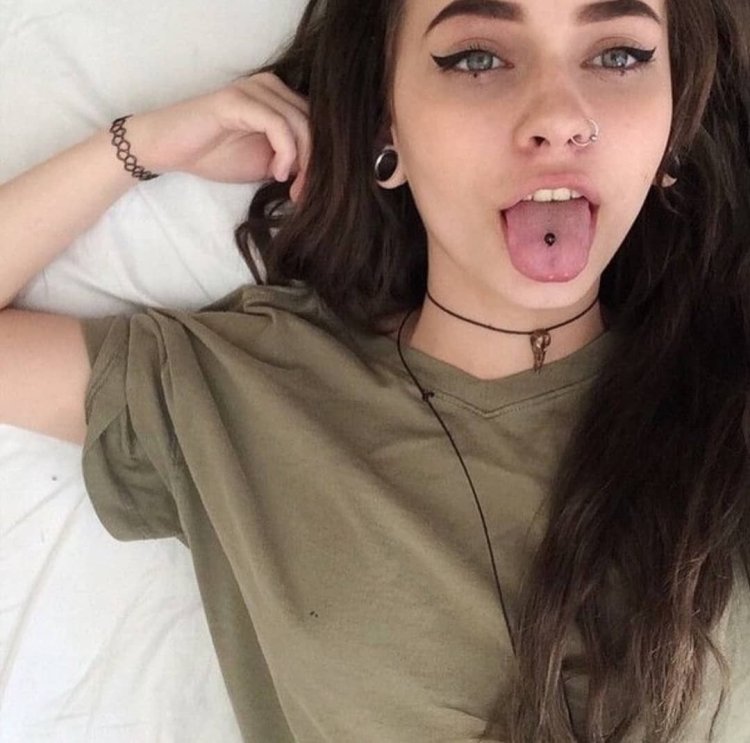 Beautiful girls with a pierced tongue