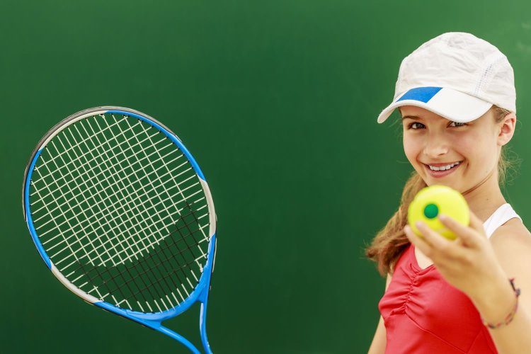 The girl plays tennis