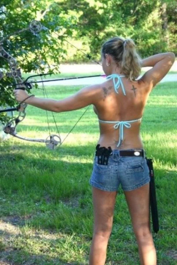 A naked woman shoots a bow