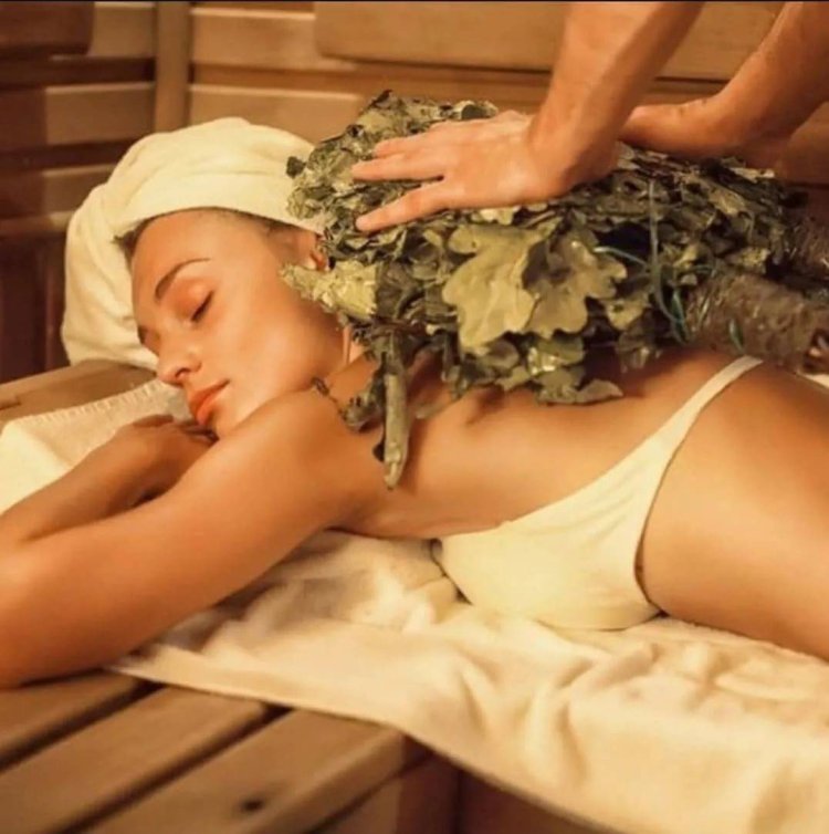 Girl in a bathhouse with a broom