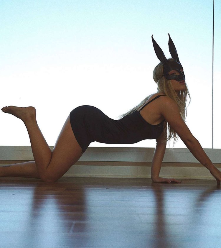 Daisy Keech in a dress