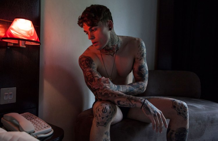 Stephen James on the bed