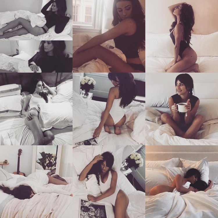 Poses for a photo shoot on the bed